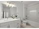 Bright bathroom featuring a large mirror, white vanity, and a shower-tub combination at 525 Parkway Dr Ne # 203, Atlanta, GA 30354