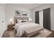 Comfortable bedroom with a large bed, neutral colors, soft lighting, and minimalist decor at 525 Parkway Dr Ne # 203, Atlanta, GA 30354