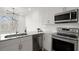 Kitchen features stainless steel appliances, marble countertops, and white cabinets at 525 Parkway Dr Ne # 203, Atlanta, GA 30354