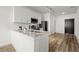 Modern kitchen featuring white cabinets, stainless steel appliances, and a countertop island at 525 Parkway Dr Ne # 203, Atlanta, GA 30354