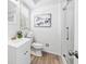 Bathroom featuring a new vanity, decorative mirror and a walk-in shower at 1523 Vancouver Dr, Tucker, GA 30084