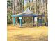 A lovely community gazebo surrounded by towering trees offers a perfect spot for outdoor gatherings at 1523 Vancouver Dr, Tucker, GA 30084