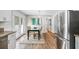 Updated kitchen with granite countertops, stainless steel appliances, and adjacent dining area at 1523 Vancouver Dr, Tucker, GA 30084