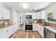 Updated kitchen featuring stainless appliances, granite countertops and abundant cabinet space at 1523 Vancouver Dr, Tucker, GA 30084