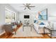 Inviting living room with natural light, ceiling fan, and stylish furnishings at 1523 Vancouver Dr, Tucker, GA 30084