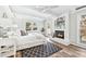 Bright main bedroom with fireplace, ensuite bathroom and ample natural light at 1523 Vancouver Dr, Tucker, GA 30084
