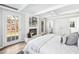 Spacious main bedroom featuring ensuite bathroom, fireplace and french door access at 1523 Vancouver Dr, Tucker, GA 30084
