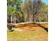 Community playground featuring a swing set, bordered by wood planks and an adjacent gazebo at 1523 Vancouver Dr, Tucker, GA 30084