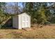 A well-maintained shed with double doors sits in the backyard, offering storage space at 1523 Vancouver Dr, Tucker, GA 30084