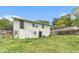 View of the house from the backyard, showing the upper and lower entry points and landscaped yard at 2302 Abner Nw Pl, Atlanta, GA 30318