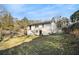 Exterior shot of the home in the backyard, featuring a fenced yard and multi-level entry at 2302 Abner Nw Pl, Atlanta, GA 30318
