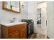 Charming bathroom features a modern sink and vanity and opens into the bedroom at 2302 Abner Nw Pl, Atlanta, GA 30318