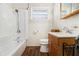 Traditional bathroom with tiled walls, updated faucet, and floral shower curtain at 2302 Abner Nw Pl, Atlanta, GA 30318