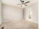 Bedroom featuring neutral walls, carpet flooring, a door with mirror and a ceiling fan at 2302 Abner Nw Pl, Atlanta, GA 30318