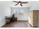 Bright bedroom features laminate flooring, a ceiling fan, and lots of natural light at 2302 Abner Nw Pl, Atlanta, GA 30318