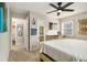 Neutral bedroom offers a ceiling fan, carpet and access to a bathroom at 2302 Abner Nw Pl, Atlanta, GA 30318