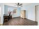 Sunlit bedroom featuring laminate flooring, a ceiling fan, and ample natural light at 2302 Abner Nw Pl, Atlanta, GA 30318