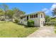 Traditional home with tidy landscaping, a long drive, and well-kept siding at 2302 Abner Nw Pl, Atlanta, GA 30318