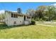 Charming home features a well-maintained lawn, classic siding, and inviting front entrance at 2302 Abner Nw Pl, Atlanta, GA 30318
