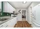 Kitchen with white cabinets and adjacent view into the living room at 2302 Abner Nw Pl, Atlanta, GA 30318