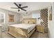 Bedroom with ceiling fan, a decorative headboard, neutral bedding, and matching nightstands at 2302 Abner Nw Pl, Atlanta, GA 30318