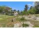 Exterior shot of the yard and home with trees, bushes, and natural surroundings at 2302 Abner Nw Pl, Atlanta, GA 30318