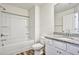 Bathroom featuring granite countertops, vinyl flooring, a bathtub, and a shower at 2240 Mulsanne Dr, Lithonia, GA 30058