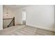 View of the upstairs hallway featuring carpeted floors and a decorative pendant light fixture at 2240 Mulsanne Dr, Lithonia, GA 30058