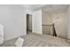 View of the carpeted upstairs hallway featuring a staircase with wood and iron details at 2240 Mulsanne Dr, Lithonia, GA 30058