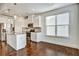 Sunlit kitchen with a center island, stainless steel appliances, and hardwood floors at 2240 Mulsanne Dr, Lithonia, GA 30058