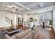 Bright living room features white cabinets, coffered ceilings, and hardwood floors at 2240 Mulsanne Dr, Lithonia, GA 30058