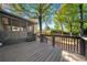 Home's back deck with wood railings and steps, perfect for outdoor entertaining and overlooking a yard at 3385 Lyndale St, Douglasville, GA 30135