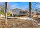 Back view of a house with a porch with screen and a deck with stairs at 3385 Lyndale St, Douglasville, GA 30135