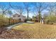 A spacious backyard featuring storage sheds and a partial fence around the perimeter at 3385 Lyndale St, Douglasville, GA 30135