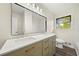 Bathroom featuring double sinks, quartz countertop, and modern finishes at 3385 Lyndale St, Douglasville, GA 30135