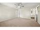 Spacious bedroom with neutral carpet, ceiling fan, and ensuite bathroom at 3385 Lyndale St, Douglasville, GA 30135