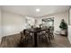 Dining room with modern table, hardwood floors, and sliding glass doors to the porch at 3385 Lyndale St, Douglasville, GA 30135