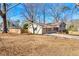 A well-maintained front yard leads up to this charming two-story home with driveway at 3385 Lyndale St, Douglasville, GA 30135