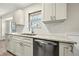 Kitchen featuring white cabinets, stainless steel appliances, and granite countertops at 3385 Lyndale St, Douglasville, GA 30135