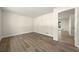 Bright living room featuring hardwood floors, fresh paint and an open doorway to other spaces at 3385 Lyndale St, Douglasville, GA 30135