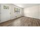 Neutral living room with lots of light and newly installed hardwood floors at 3385 Lyndale St, Douglasville, GA 30135