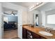 Bright bathroom features granite countertops, double sinks, and an open view to the bedroom for a spa-like experience at 599 Jefferson Chase St, Atlanta, GA 30354