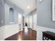 Welcoming foyer with hardwood floors, wainscoting, and arched doorway at 599 Jefferson Chase St, Atlanta, GA 30354