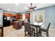 Eat-in kitchen featuring wood cabinets, tile flooring, and a black appliance package at 599 Jefferson Chase St, Atlanta, GA 30354