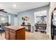 Open kitchen features tile flooring, a center island, and seamless view to dining room at 599 Jefferson Chase St, Atlanta, GA 30354