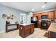 Well-lit kitchen features stainless steel appliances, tile floors, and a center island at 599 Jefferson Chase St, Atlanta, GA 30354