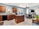 Open concept kitchen with tile floors, wooden island, and adjacent dining area at 599 Jefferson Chase St, Atlanta, GA 30354