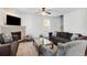 Comfortable living room features hardwood floors, a decorative fireplace, and natural light at 599 Jefferson Chase St, Atlanta, GA 30354