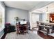 Bright office connected to dining area features hardwood floors and a neutral palette at 599 Jefferson Chase St, Atlanta, GA 30354