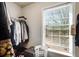 Organized walk-in closet with ample hanging space, shelving, and a window, providing functional storage and natural light at 599 Jefferson Chase St, Atlanta, GA 30354